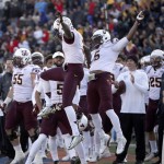 Arizona State's defenders Damarious Randall, left, and Chad Adams celebrate an interception during the fourth quarter of the Sun Bowl NCAA college football game against Duke, Saturday, Dec. 27, 2014, in El Paso, Texas. (AP Photo/Victor Calzada)