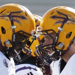 Arizona State's Taylor Kelly, right, bangs helmets with Jaelen Strong prior to an NCAA college football game against New Mexico ib Saturday, Sept. 6, 2014, in Albuquerque, N.M. (AP Photo/Ross D. Franklin)