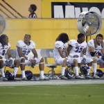 Weber State players sit on the bench during the second half of an NCAA college football game against Arizona State, Thursday, Aug. 28, 2014, in Tempe, Ariz. (AP Photo/Matt York)