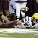 Arizona State defender Viliami Moeakiola eyes the ball after narrowly missing an interception against Washington in the first half of an NCAA college football game Saturday, Oct. 25, 2014, in Seattle. (AP Photo/Elaine Thompson)
