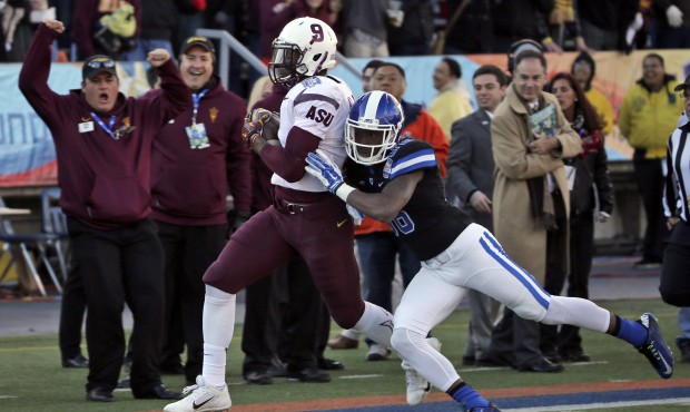 Arizona State’s Kalen Ballage, left, is pushed out of bounds by Duke’s Terrance Als aft...
