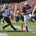Stanford running back Anthony Wilkerson (32) celebrates after a touchdown run past Arizona State safety Alden Darby, left, during the first half of an NCAA college football game Saturday, Sept. 21, 2013, in Stanford, Calif. (AP Photo/Marcio Jose Sanchez)