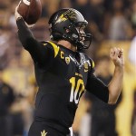 Arizona State's Taylor Kelly throws a pass against Wisconsin in the first half of an NCAA college football game on Saturday, Sept. 14, 2013, in Phoenix. (AP Photo/Ross D. Franklin)