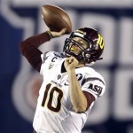 Arizona State quarterback Taylor Kelly fires a pass against Texas Tech during the first half of the Holiday Bowl NCAA college football game, Monday, Dec. 30, 2013, in San Diego. Kelly was held to 14 yards passing in the first half. (AP Photo/Lenny Ignelzi)
