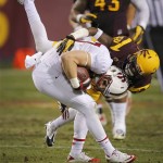 Stanford wide receiver Jordan Pratt, left, is tackled by Arizona State defensive back Robert Nelson during the first half of the NCAA Pac-12 Championship football game, Saturday, Dec. 7, 2013, in Tempe, Ariz. (AP Photo/Matt York)
