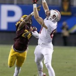 Stanford's Jordan Pratt, right, beats Arizona State's Osahon Irabor (24) for a long pass reception during the first half of the NCAA Pac-12 Championship football game Saturday, Dec. 7, 2013, in Tempe, Ariz. (AP Photo/Ross D. Franklin)
