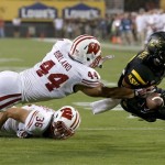 Wisconsin's Chris Borland (44) and Ethan Armstrong (36) are able to bring down Arizona State's Frederick Gammage short of the endzone in the first half of an NCAA college football game on Saturday, Sept. 14, 2013, in Phoenix. (AP Photo/Ross D. Franklin)