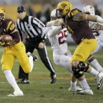 Arizona State running back D.J. Foster, left, breaks free for a touchdown as teammate Tyler Sulka blocks Stanford safety Ed Reynolds (29) during the first half of the NCAA Pac-12 Championship football game, Saturday, Dec. 7, 2013, in Tempe, Ariz. (AP Photo/Matt York)
