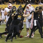 Arizona State's Gannon Conway (95) celebrates a win against Wisconsin as time expires in the second half of an NCAA college football game on Saturday, Sept. 14, 2013, in Phoenix. Arizona State defeated Wisconsin 32-30. (AP Photo/Ross D. Franklin)