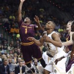 Arizona State's Jahii Carson (1) drives past Baylor Rico Gathers, right, during the first half of an NIT second-round college basketball game in Waco, Texas, Friday, March 22, 2013. (AP Photo/Waco Tribune Herald, Rod Aydelotte)
