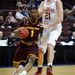 Arizona State's Jahii Carson (1) drives for the basket against Arkansas' Hunter Mickelson (21) defending during the first half of an NCAA college basketball game at the Continental Tire Las Vegas Invitational tournament on Friday, Nov. 23, 2012, in Las Vegas. (AP Photo/David Becker)