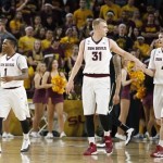 Arizona State's Jahii Carson (1); Jonathan Gilling (31), of Denmark; and Bo Barnes (4) do some early celebrating as Colorado is forced to call a timeout during the second half of an NCAA basketball game Saturday, Jan. 25, 2014, in Tempe, Ariz. Arizona State defeated Colorado 72-51. (AP Photo/Ross D. Franklin)