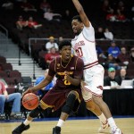 Arizona State's Carrick Felix (0) drives for the basket with Arkansas' Rashad Madden (00) defending during the first half of an NCAA college basketball game at the Continental Tire Las Vegas Invitational tournament on Friday, Nov. 23, 2012, in Las Vegas. (AP Photo/David Becker)