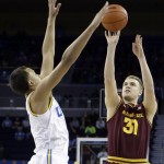 Arizona State forward Jonathan Gilling (31), of Denmark, puts up a shot at three-point range as UCLA guard Kyle Anderson defends in the first half of an NCAA college basketball game in Los Angeles Wednesday, Feb. 27, 2013. (AP Photo/Reed Saxon)