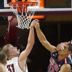 Arizona's Nick Johnson (13) has his shot blocked by Arizona State's Jonathan Gilling (31) and is hit in the face by Arizona State's Jordan Bachynski during the first half of an NCAA college basketball game on Friday, Feb. 14, 2014, in Tempe, Ariz. (AP Photo/Ross D. Franklin)