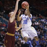 UCLA's Larry Drew II (10) goes up for a shot against Arizona State's Jonathan Gilling during the first half of a Pac-12 men's tournament NCAA college basketball game, Thursday, March 14, 2013, in Las Vegas. (AP Photo/Julie Jacobson)