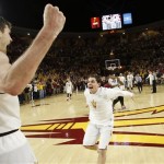 Arizona State's Jordan Bachynski, left, celebrates with teammate Jarett Upchurch, right, just prior to time expiring during the second overtime against Arizona during an NCAA college basketball game, Friday, Feb. 14, 2014, in Tempe, Ariz. Arizona State defeated Arizona 69-66 in double overtime. (AP Photo/Ross D. Franklin)