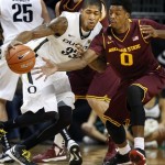 Oregon's Carlos Emory, left, collides with Arizona State's Carrick Felix during the first half of an NCAA college basketball game in Eugene, Ore. Sunday Jan. 13, 2013. (AP Photo/Chris Pietsch)
