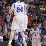 UCLA's Travis Wear (24) celebrates with Larry Drew II (10) after hitting a 3-point basket with the score tied against Arizona State late in the NCAA college basketball game during the Pac-12 men's tournament, Thursday, March 14, 2013, in Las Vegas. UCLA won 80-75. (AP Photo/Julie Jacobson)