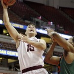 Arizona State guard/forward Egor Koulechov (15) shoots as Miami guard Garrius Adams defends in the first half of an NCAA men's college basketball game at the Wooden Legacy tournament in Anaheim, Calif., Sunday, Dec. 1, 2013. (AP Photo/Reed Saxon)