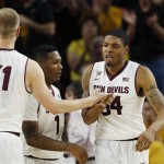 Arizona State's Jermaine Marshall, right, celebrates a score against Arizona with teammates Jonathan Gilling (31) and Jahii Carson (1) during the second half of an NCAA college basketball game, Friday, Feb. 14, 2014, in Tempe, Ariz. Arizona State defeated Arizona 69-66 in double overtime. (AP Photo/Ross D. Franklin)
