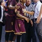 Arizona State's Carrick Felix, left, and Jahii Carson are held back by a referee after a double technical foul was called near the end of their Pac-12 tournament NCAA college basketball game against UCLA, Thursday, March 14, 2013, in Las Vegas. UCLA won 80-75. (AP Photo/Julie Jacobson)