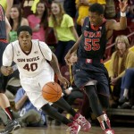 Utah's Delon Wright (55) tries to regain control of the ball as Arizona State's Shaquielle McKissic (40) closes in to defend during the second half of an NCAA basketball game Thursday, Jan. 23, 2014, in Tempe, Ariz. Arizona State defeated Utah 79-75. (AP Photo/Ross D. Franklin)