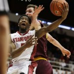 Stanford guard Chasson Randle, left, goes to the basket as Arizona State center Jordan Bachynski, right, looks on during the second half of their NCAA college basketball game Saturday, Feb. 1, 2014, in Stanford, Calif. Stanford won the game 76-70. (AP Photo/Eric Risberg)