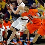 Oregon State's Eric Moreland (15) and Arizona State's Jordan Bachynski chase down a lose ball during the first half of an NCAA college basketball game, Thursday, Feb. 6, 2014, in Tempe, Ariz. (AP Photo/Matt York)