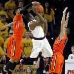 Arizona State's Shaquielle McKissic, center, shoots between Oregon State's Roberto Nelson, right, and Eric Moreland during the first half of an NCAA college basketball game, Thursday, Feb. 6, 2014, in Tempe, Ariz. (AP Photo/Matt York)