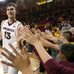 Arizona State's Jordan Bachynski (13) gets high-fives from fans after an NCAA basketball game win against Utah Thursday, Jan. 23, 2014, in Tempe, Ariz. Arizona State defeated Utah 79-75. (AP Photo/Ross D. Franklin)