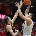  Arizona's Kaleb Tarczewski, right, shoots for two points over the attempted defense of Arizona State's Jordan Bachynski, left, in the first half of an NCAA college basketball game on Thursday, Jan. 16, 2014, in Tucson, Ariz. (AP Photo/John Miller)
