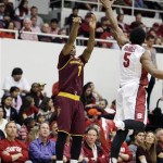 Arizona State guard Jahii Carson, left, makes a three-point basket as Stanford guard Chasson Randle, right, looks on during the first half of their NCAA college basketball game Saturday, Feb. 1, 2014, in Stanford, Calif. (AP Photo/Eric Risberg)