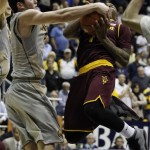 California's Sam Singer, left, struggles for the ball with Arizona State's Jahii Carson during the second half of an NCAA college basketball game, Wednesday, Jan. 29, 2014 in Berkeley, Calif. (AP Photo/George Nikitin)