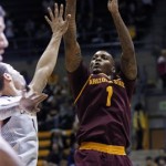 Arizona State's Jahii Carson shoots as California's Justin Cobbs defends during the first half of an NCAA college basketball game, Wednesday, Jan. 29, 2014, in Berkeley, Calif. (AP Photo/George Nikitin)