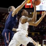 Arizona State's Jermaine Marshall, right, has his shot blocked by Arizona's Gabe York, left, during the first half of an NCAA college basketball game on Friday, Feb. 14, 2014, in Tempe, Ariz. (AP Photo/Ross D. Franklin)