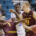 Arizona State's Jahii Carson (1) gets tangled up with UCLA's Jordan Adams (3) as Jonathan Gilling (31) tries to hand the ball off during the first half during a Pac-12 Conference tournament NCAA college basketball game, Thursday, March 14, 2013, in Las Vegas. (AP Photo/Julie Jacobson)