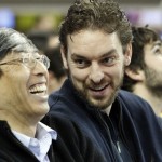Los Angeles Lakers forward Pau Gasol, right, chats with Patrick Soon-Shiong, a minority owner of the Lakers, at an Arizona State-UCLA NCAA college basketball game in Los Angeles Wednesday, Feb. 27, 2013. (AP Photo/Reed Saxon)