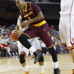 Arizona State's Jahii Carson is fouled by Southern California's Chass Bryan, rear, during the first half of an NCAA college basketball game, Thursday, Jan. 9, 2014, in Los Angeles. (AP Photo/Danny Moloshok)