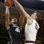 Colorado's Josh Scott (40) gets fouled by Arizona State's Jordan Bachynski, right, as he goes up for a shot during the first half of an NCAA college basketball game Saturday, Jan. 25, 2014, in Tempe, Ariz. (AP Photo/Ross D. Franklin)