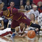Arizona State guard Jahii Carson, top, goes after the ball as Stanford guard/forward Anthony Brown, bottom, looks on during the first half of their NCAA college basketball game Saturday, Feb. 1, 2014, in Stanford, Calif. (AP Photo/Eric Risberg)