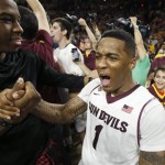 Arizona State's Jahii Carson (1) celebrates on the court after an NCAA college basketball game win against Arizona, Friday, Feb. 14, 2014, in Tempe, Ariz. Arizona State defeated Arizona 69-66 in double overtime. (AP Photo/Ross D. Franklin)