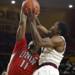 Arizona State's Shaquielle McKissic, right, gets fouled by UNLV's Goodluck Okonoboh (11) as McKissic goes up for a shot during the second half of an NCAA college basketball game Wednesday, Dec. 3, 2014, in Tempe, Ariz. Arizona State defeated UNLV 77-55. (AP Photo/Ross D. Franklin)