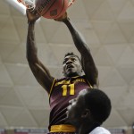 Arizona State's Savon Goodman dunks over Connecticut's Terrence Samuel, in the second half of an NCAA college basketball game in the first round of the NIT postseason tournament, Wednesday, March 18, 2015, in Storrs, Conn. Arizona State won 68-61. (AP Photo/Jessica Hill)
