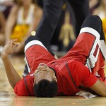 UNLV's Rashad Vaughn grimaces as he grabs his lower back due to injury during the second half of an NCAA college basketball game against Arizona State Wednesday, Dec. 3, 2014, in Tempe, Ariz. Arizona State defeated UNLV 77-55. (AP Photo/Ross D. Franklin)