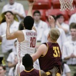 Washington State guard Dexter Kernich-Drew (10) drives to the basket past Arizona State forward Savon Goodman (11) and forward Johnathan Gilling (31) during the first half of an NCAA college basketball game, Friday, Feb 13, 2015, in Pullman, Wash. (AP Photo/Gary Breedlove)