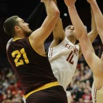 Arizona State forward Eric Jacobsen (21) draws the foul on Washington State guard Dexter Kernich-Drew (10) during the second half of an NCAA college basketball game, Friday, Feb 13, 2015, in Pullman, Wash. Washington State won 74-71 (AP Photo/Gary Breedlove)