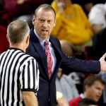 Utah head coach Larry Krystkowiak, right, argues with the referee during the first half of an NCAA college basketball game against Arizona State, Thursday, Jan. 15, 2015, in Tempe, Ariz. (AP Photo/Matt York)