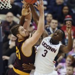Arizona State's Eric Jacobsen, left, battles for a rebound against Connecticut's Kentan Facey, center, and Terrence Samuel, right, battle in the first half of an NCAA college basketball game in the first round of the NIT postseason tournament, Wednesday, March 18, 2015, in Storrs, Conn. (AP Photo/Jessica Hill)