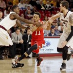 Utah's Brandon Taylor (11) fights through Arizona State's, right, and Gerry Blakes, left, during the first half of an NCAA college basketball game, Thursday, Jan. 15, 2015, in Tempe, Ariz. (AP Photo/Matt York)